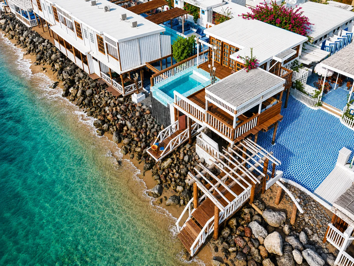 Aerial coastline — turquoise sea and Banan Beach architecture