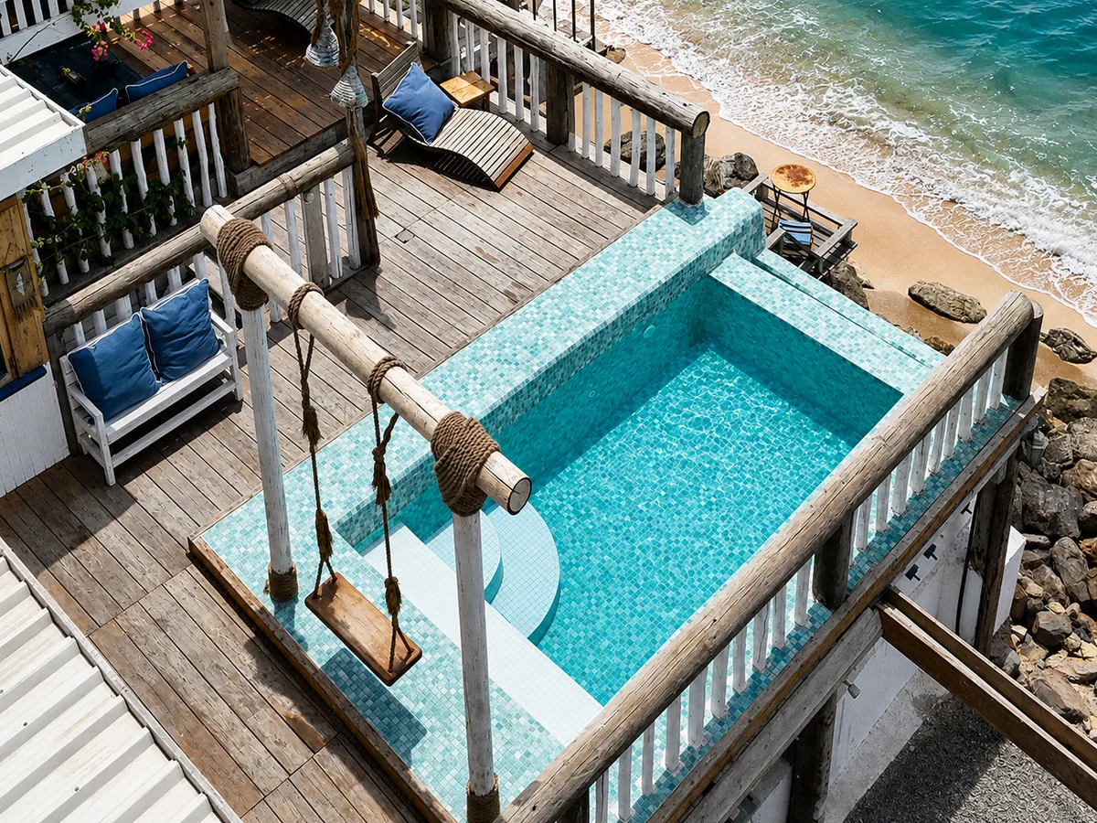 Private seafront pool with rope swing beside the sea